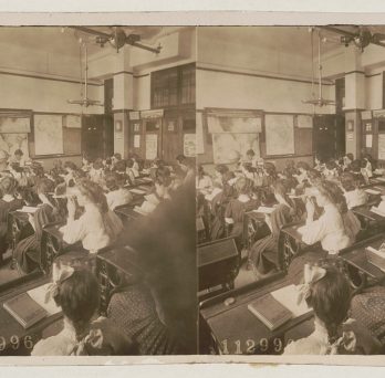 Underwood & Underwood (publisher), Children in geography class viewing stereoscopic photographs, New York, 1908. Stereograph.
                  